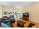 Open living room featuring a fireplace, hardwood floors, and a large TV at 40 Costleys Bridge Dr, Oxford, GA 30054