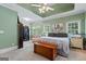 Serene main bedroom with tray ceiling, natural light, and ample space for a seating area, creating a relaxing atmosphere at 40 Costleys Bridge Dr, Oxford, GA 30054