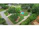 Expansive aerial view of home highlighting the landscaped lawn and refreshing swimming pool at 15 Livingston Way, Covington, GA 30016