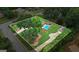 Expansive aerial view of home highlighting the landscaped lawn and refreshing swimming pool at 15 Livingston Way, Covington, GA 30016