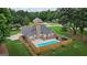 Aerial view of backyard oasis featuring a sparkling pool and fenced-in area at 15 Livingston Way, Covington, GA 30016