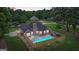 Aerial view of backyard oasis featuring a sparkling pool and fenced-in area at 15 Livingston Way, Covington, GA 30016