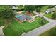 Expansive aerial view of home highlighting the landscaped lawn and refreshing swimming pool at 15 Livingston Way, Covington, GA 30016