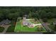 Aerial view of home with pool, lovely landscaping, and a spacious yard in a residential neighborhood at 15 Livingston Way, Covington, GA 30016