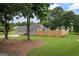 The home's backyard featuring a fenced perimeter and a well-maintained lawn at 15 Livingston Way, Covington, GA 30016