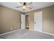 Bedroom with carpet, ceiling fan, and doors at 15 Livingston Way, Covington, GA 30016