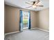 Cozy bedroom with a ceiling fan and a bright window at 15 Livingston Way, Covington, GA 30016