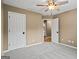 Neutral bedroom with ceiling fan, carpet, and doorways at 15 Livingston Way, Covington, GA 30016