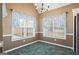 Dining area with lots of natural light, and chandelier, perfect for entertaining at 15 Livingston Way, Covington, GA 30016