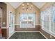 Cozy dining area with natural light and views of the pool through multiple windows at 15 Livingston Way, Covington, GA 30016