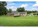 Charming single-story home with a well-manicured lawn and tasteful neutral siding and trim at 15 Livingston Way, Covington, GA 30016