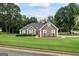 Charming single-story home with a well-manicured lawn and landscaping; features neutral tones at 15 Livingston Way, Covington, GA 30016