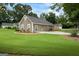 Lovely single-story home featuring a large front yard, neutral siding, and a paved driveway at 15 Livingston Way, Covington, GA 30016
