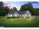 Charming home exterior with well-manicured lawn and inviting front entrance at 15 Livingston Way, Covington, GA 30016
