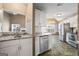 Open kitchen design featuring white cabinetry, stainless appliances, and eat-in area at 15 Livingston Way, Covington, GA 30016