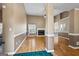 Open-concept living room boasts hardwood floors, a cozy fireplace, and elegant trim, creating a welcoming atmosphere for relaxation and gatherings at 15 Livingston Way, Covington, GA 30016