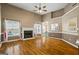 Spacious living room features hardwood floors, a warm fireplace, and large windows for a bright and inviting gathering space at 15 Livingston Way, Covington, GA 30016