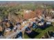 An aerial shot of a suburban neighborhood with well-kept lawns and mature trees displaying fall colors at 355 Woodbyne Dr, Fayetteville, GA 30214