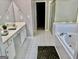 The bathroom features double sinks, shower, bath tub, and tiled floor at 355 Woodbyne Dr, Fayetteville, GA 30214
