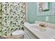 Bathroom featuring a vanity, sink, toilet and shower with decorative curtain at 355 Woodbyne Dr, Fayetteville, GA 30214
