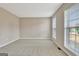Empty bedroom with neutral walls, large windows, and a clean, spacious layout at 355 Woodbyne Dr, Fayetteville, GA 30214