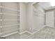 A large empty walk-in closet with shelves at 355 Woodbyne Dr, Fayetteville, GA 30214