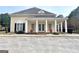 Community Club House with white columns and red planters at 355 Woodbyne Dr, Fayetteville, GA 30214