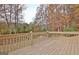 Wooden deck overlooking a private backyard with mature trees at 355 Woodbyne Dr, Fayetteville, GA 30214
