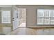 Open doorway with hardwood floors that lead to a private wooden deck at 355 Woodbyne Dr, Fayetteville, GA 30214