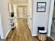 Welcoming hallway with gleaming hardwood floors, a console table, and decorative accents at 355 Woodbyne Dr, Fayetteville, GA 30214