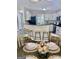 Open concept kitchen featuring granite counters, bar seating, and stainless steel appliances at 355 Woodbyne Dr, Fayetteville, GA 30214