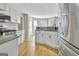 Bright kitchen showcasing stainless steel appliances, granite countertops, and hardwood floors at 355 Woodbyne Dr, Fayetteville, GA 30214