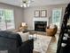 Cozy living room with fireplace, comfortable seating, and natural light at 355 Woodbyne Dr, Fayetteville, GA 30214