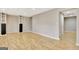Large living room features wood-look flooring, neutral walls and recessed lights at 355 Woodbyne Dr, Fayetteville, GA 30214