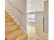 Bright staircase with wood treads and handrail leading to the finished basement at 355 Woodbyne Dr, Fayetteville, GA 30214
