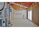 Unfinished utility room with concrete floor, mechanicals, and exterior access at 355 Woodbyne Dr, Fayetteville, GA 30214