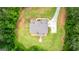 Aerial view of the house and surrounding landscape, showcasing the expansive yard and lush greenery at 74 Riverwood Trl, Grantville, GA 30220