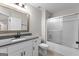 Well-lit bathroom featuring neutral colors, a shower-tub combo, and modern vanity at 74 Riverwood Trl, Grantville, GA 30220