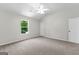 Bedroom featuring a vaulted ceiling, ceiling fan, plush carpet, and bright window at 74 Riverwood Trl, Grantville, GA 30220