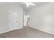 Serene bedroom with plush carpeting, providing comfort and warmth and an open doorway, perfect for a peaceful night's rest at 74 Riverwood Trl, Grantville, GA 30220