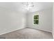 Cozy bedroom with plush carpeting and a window that allows for natural light, creating a serene atmosphere at 74 Riverwood Trl, Grantville, GA 30220