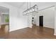 Spacious dining area with modern lighting and wainscoting, ideal for Gathering gatherings at 74 Riverwood Trl, Grantville, GA 30220
