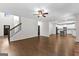Bright, open living area with hardwood floors flowing into the kitchen and a staircase at 74 Riverwood Trl, Grantville, GA 30220