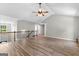 Bright open living space with hardwood floors, ceiling fan and an open staircase at 74 Riverwood Trl, Grantville, GA 30220