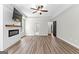 Bright living room with hardwood floors and a modern fireplace beneath a wall-mounted TV at 74 Riverwood Trl, Grantville, GA 30220