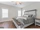 Serene bedroom with ample natural light, hardwood floors, and a comfortable king-sized bed at 135 Brookshire Dr, Fayetteville, GA 30215
