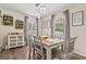 Inviting dining room featuring a decorative cabinet, table, and chairs at 135 Brookshire Dr, Fayetteville, GA 30215