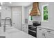 Contemporary kitchen with a double oven, ample counter space, and white cabinetry at 135 Brookshire Dr, Fayetteville, GA 30215