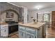 Kitchen with a butcher block island, stainless steel stove, and white cabinets at 135 Brookshire Dr, Fayetteville, GA 30215