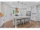 Bright kitchen with white cabinets, subway tile backsplash, and a large center island at 135 Brookshire Dr, Fayetteville, GA 30215
